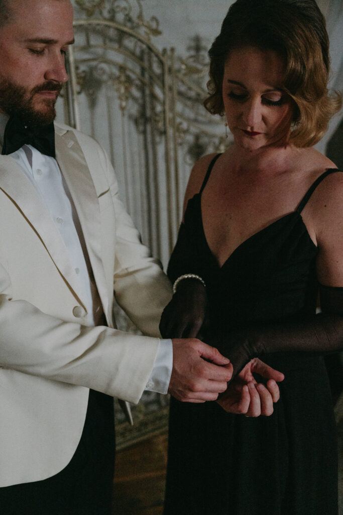 wife helping husband with cufflinks