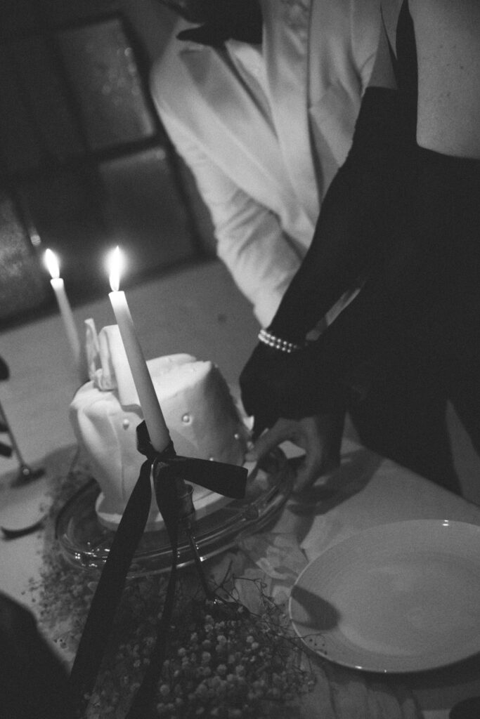 husband and wife cutting a cake