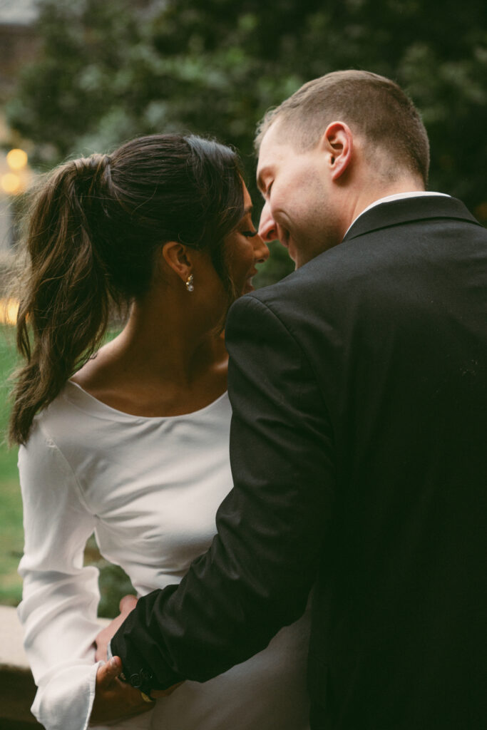 husband and wife smiling at each other before they kiss