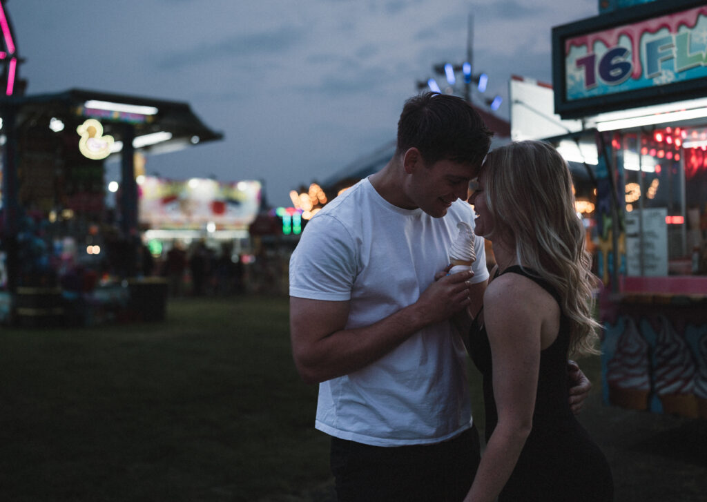 couple sharing an ice cream cone together