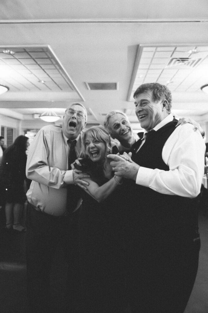 group photo of older family members smiling and laughing