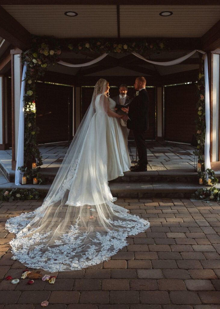 bride and groom joined hands at the altar