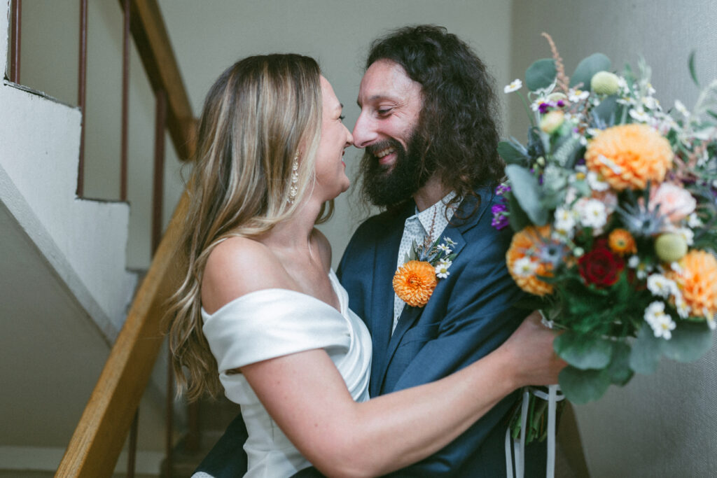 couple smiling at each other with noses touching at their elopement